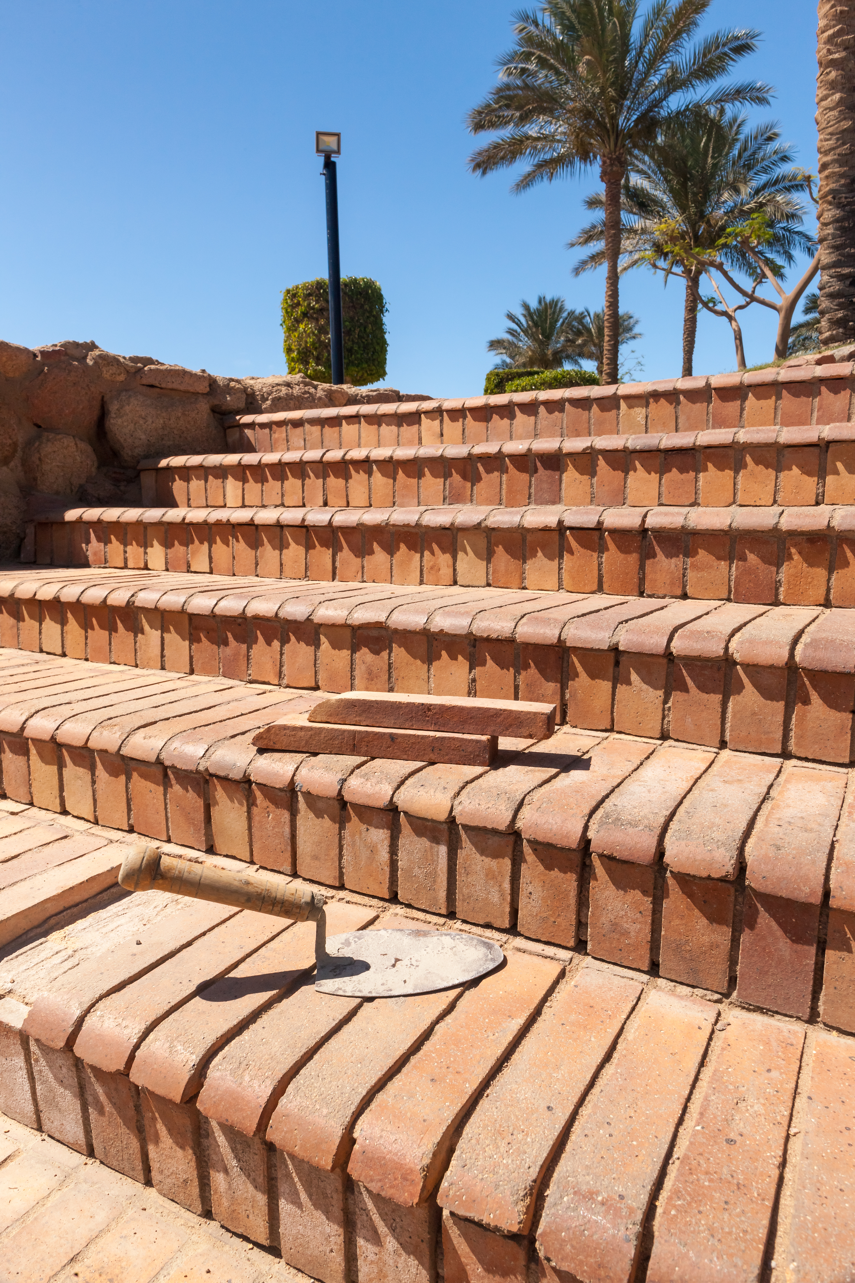 Hand-laid stone patio with detailed masonry edges
